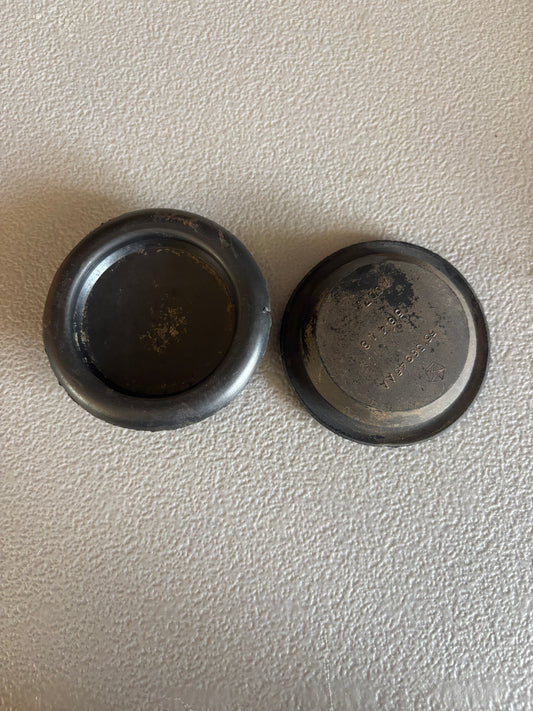 Upper Control Arm Rubber Plug.  Access Hole/Hides The Bolt